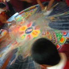 Monks destroying a sand mandala