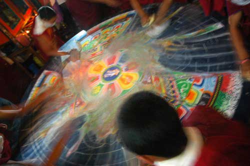 Monks destroying a sand mandala