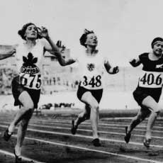 Myrtle Cook of Canada (left) winning a preliminary heat in the women's 100 metres race at the VIIIth Summer Olympic Games