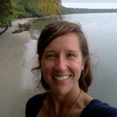 Photo of my friend Jess on a tropical beach. She's a travelling volunteer.