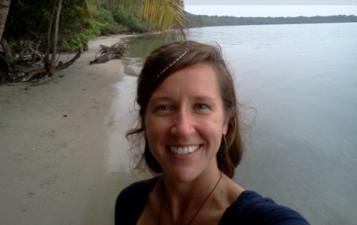 Photo of my friend Jess on a tropical beach. She's a travelling volunteer.