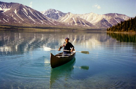 Dick Proenneke Alone in the Wilderness paddling a canoe in Twin Lakes, Alaska